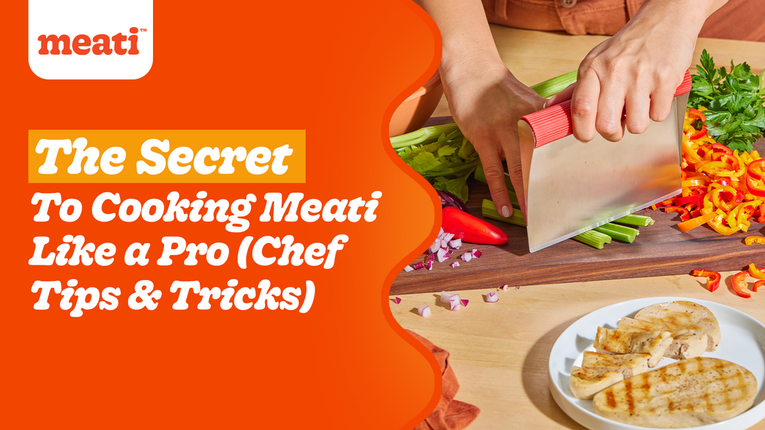 A person chopping vegetables on a cutting board