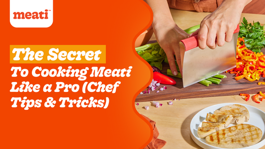 A person chopping vegetables on a cutting board