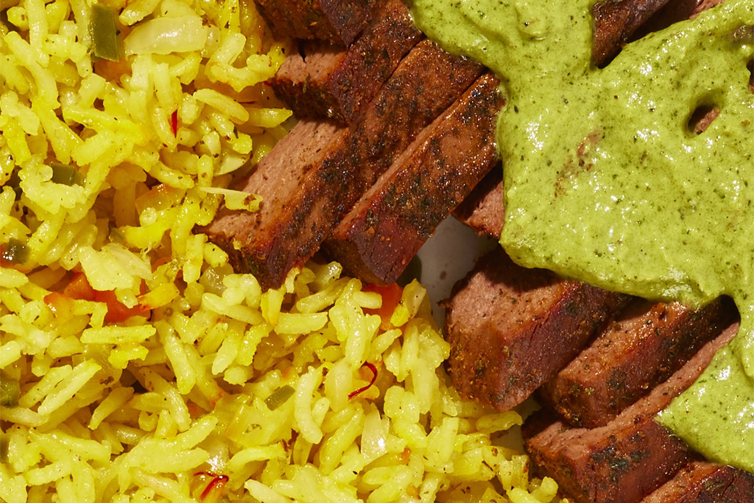 Meati™ Carne Asada Steaks with Poblano Chimichurri and Sofrito-Saffron Rice recipe